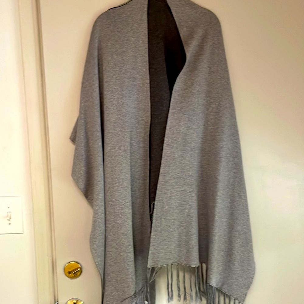 Subtle Luxury sweater style wrap. Perfect for a chilly evening out. Like new.